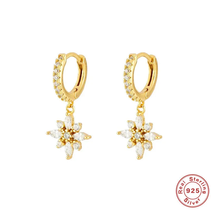 A pair of women's S925 sterling silver snowflake pendant earrings with a geometric design, available in yellow gold or white gold colour finishes.