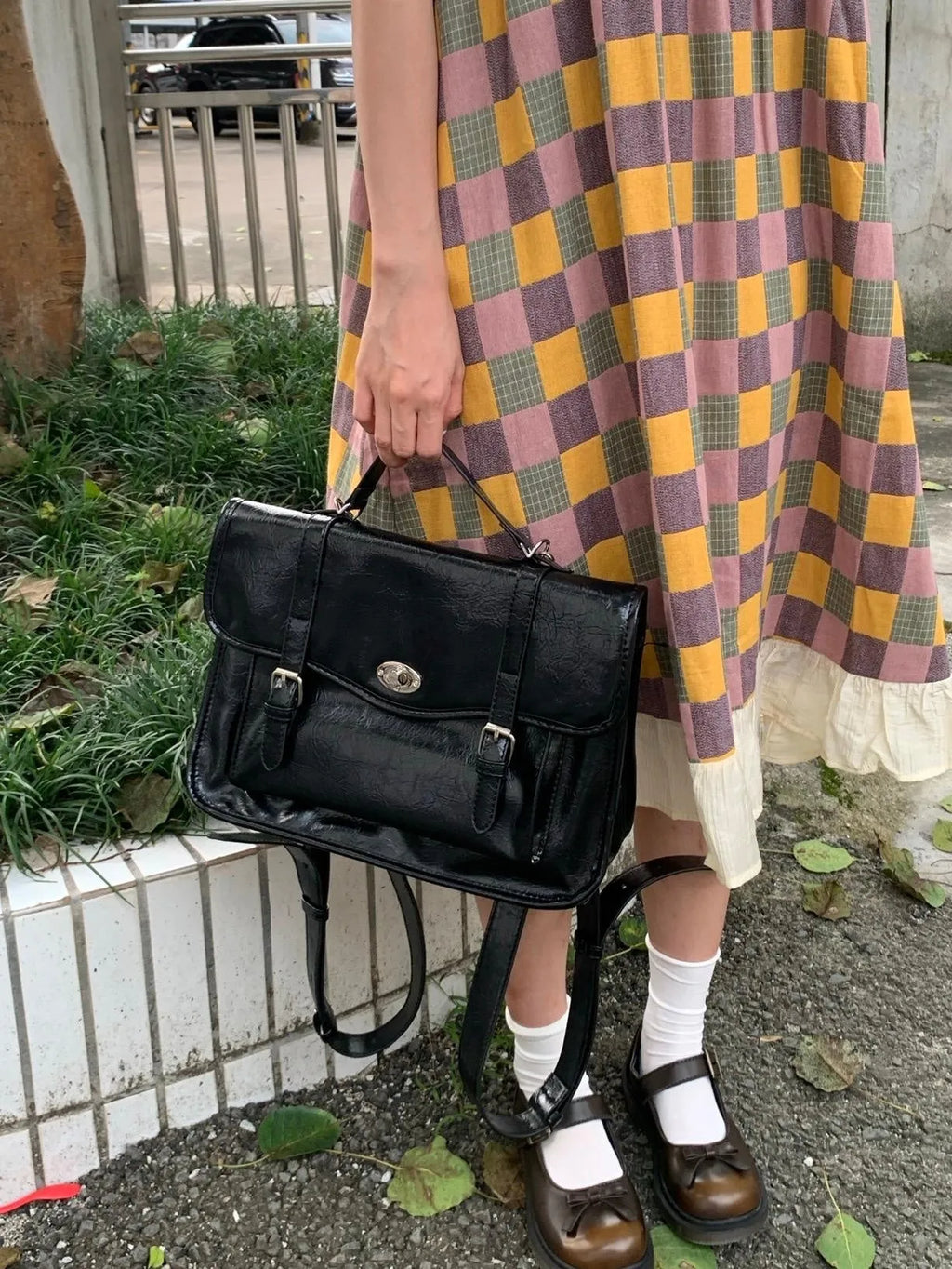 Black oil wax leather-style messenger bag for women with 35cm length and shoulder strap