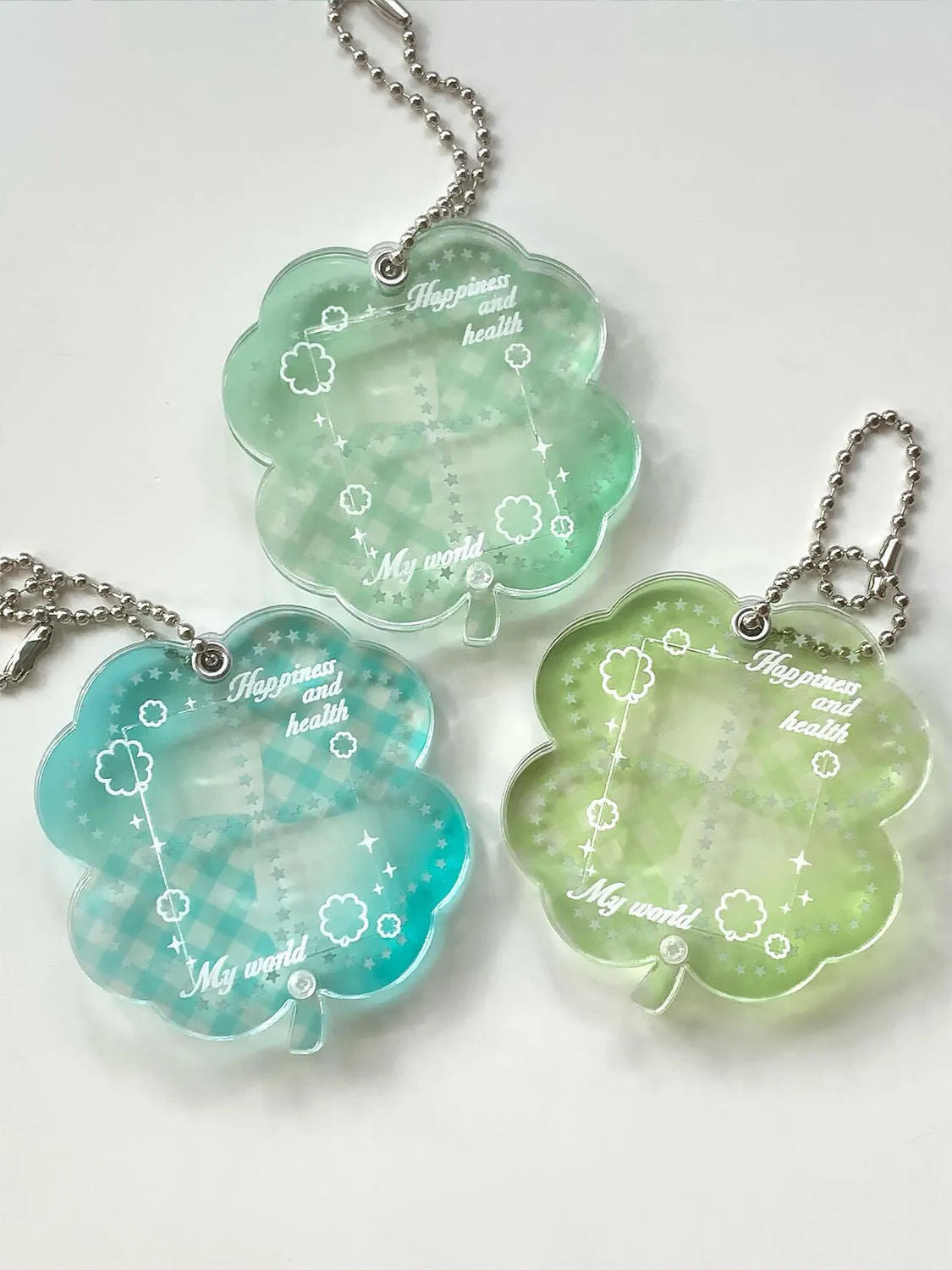 Acrylic four-leaf clover phone pendant keychain in blue, green and mint colours