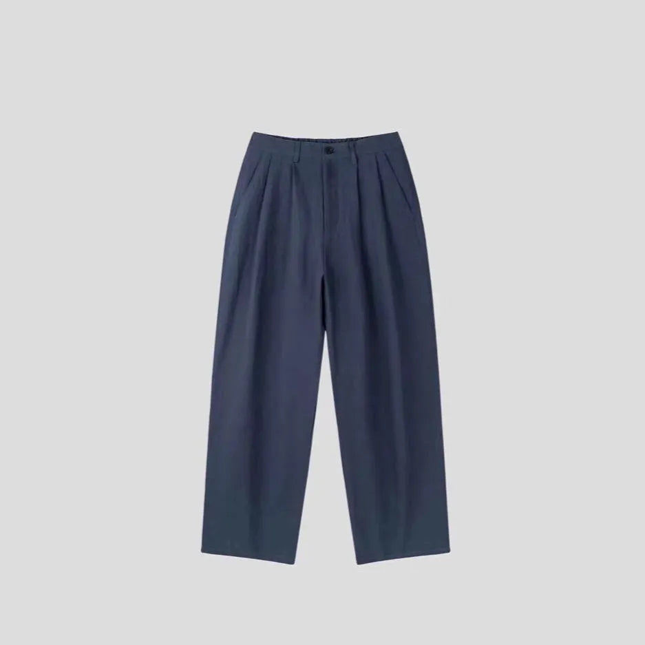 Men's loose lightweight cotton linen trousers in apricot colour showing wide-leg Korean style design