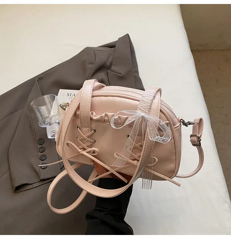 Women's PU bandage bow handbag in milky white with shoulder strap and sewing thread detailing