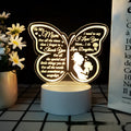 White heart-shaped acrylic table lamp with USB cable and touch control on a wooden surface