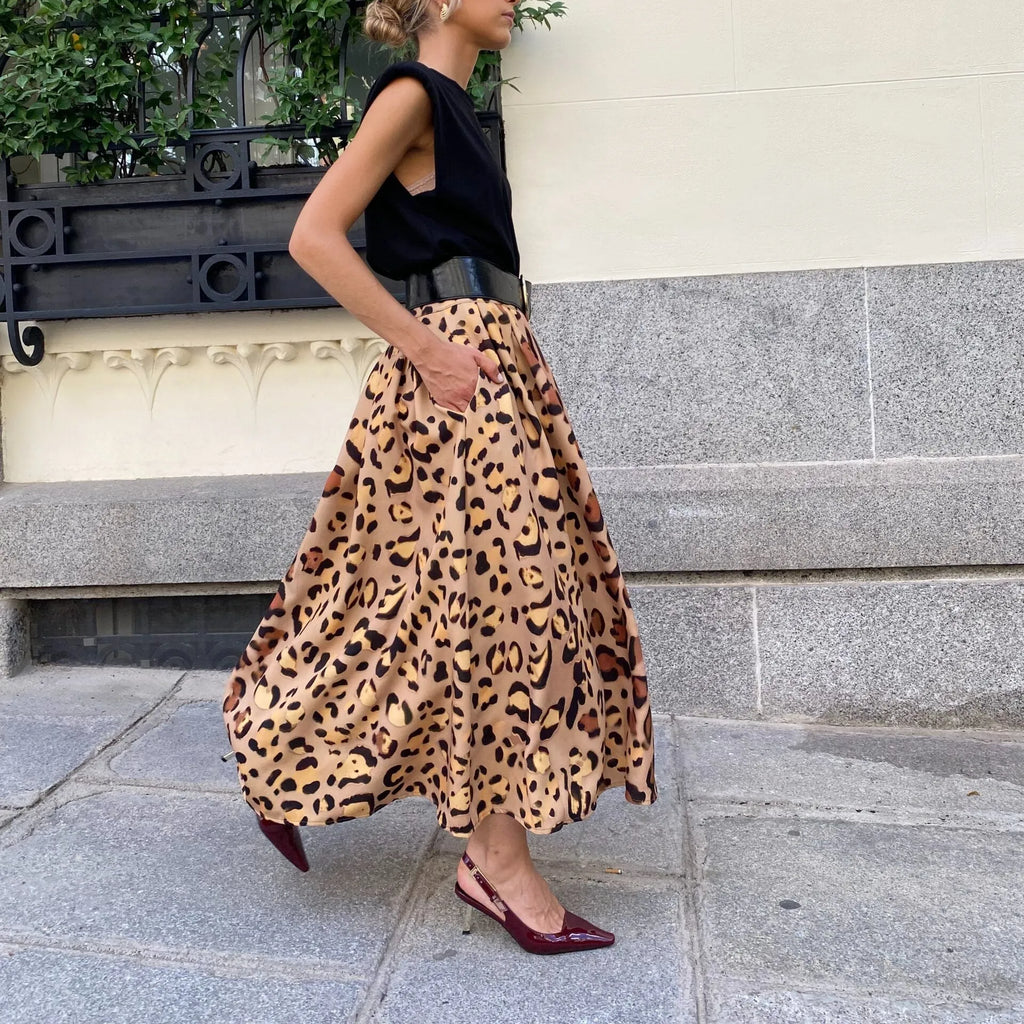 Brown leopard print women's A-line long skirt with elastic waistband on hanger