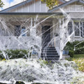 White cotton spider web Halloween decoration with plastic spiders in various pack sizes