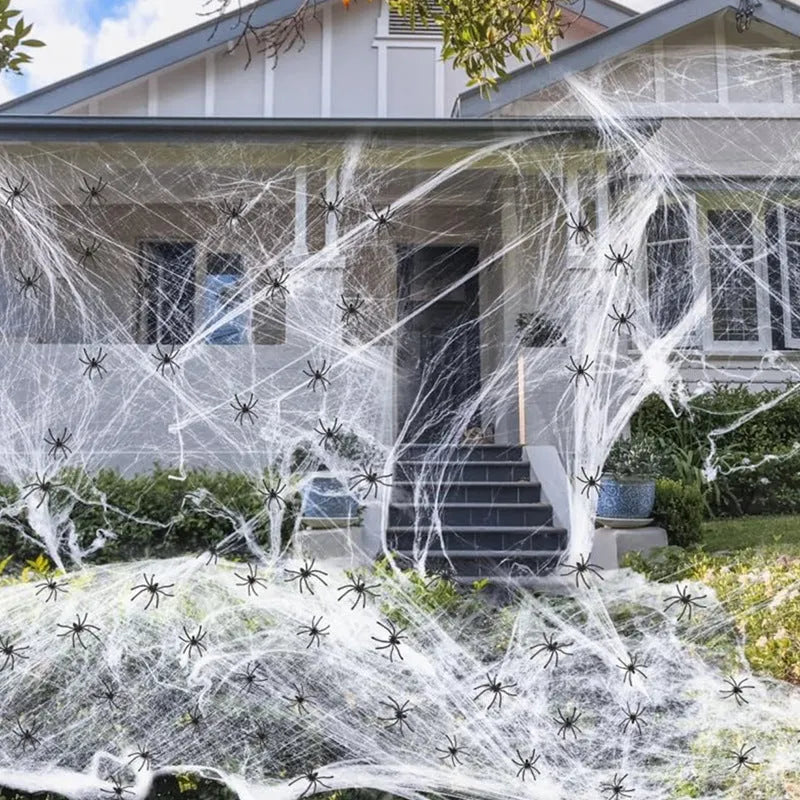 White cotton spider web Halloween decoration with plastic spiders in various pack sizes
