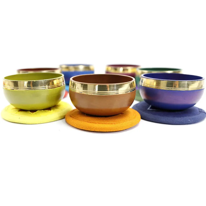 Handmade Himalayan singing bowl percussion instrument in seven colours for yoga meditation