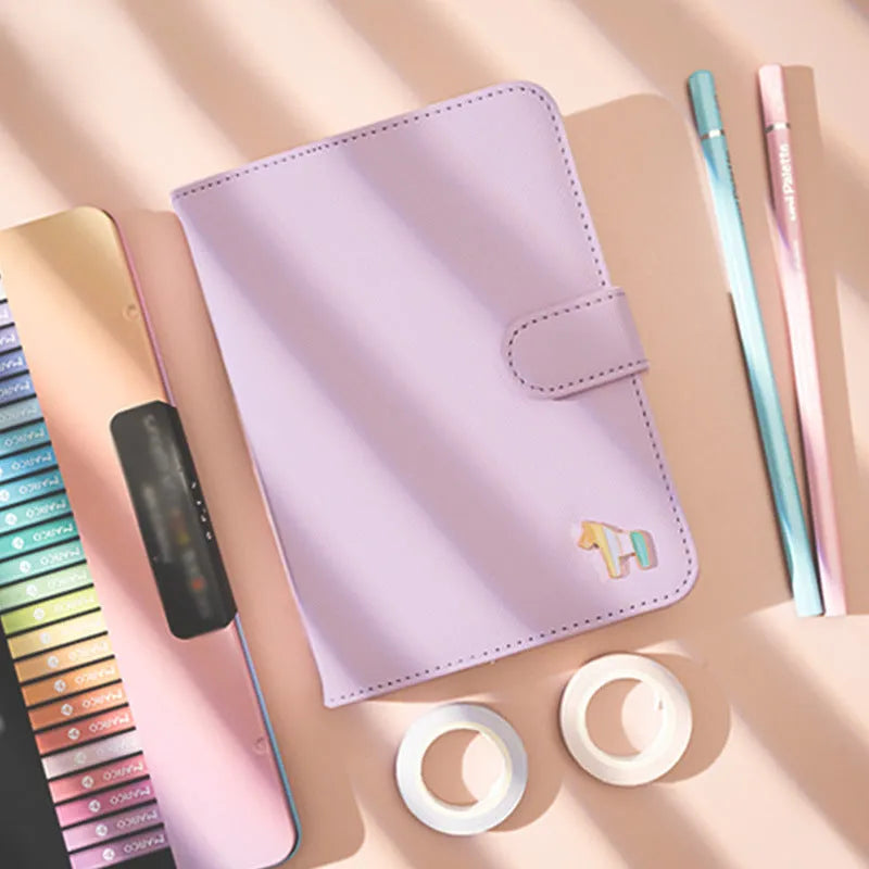 Compact leather-covered 396-day schedule book for hand accounting, shown lying open flat.