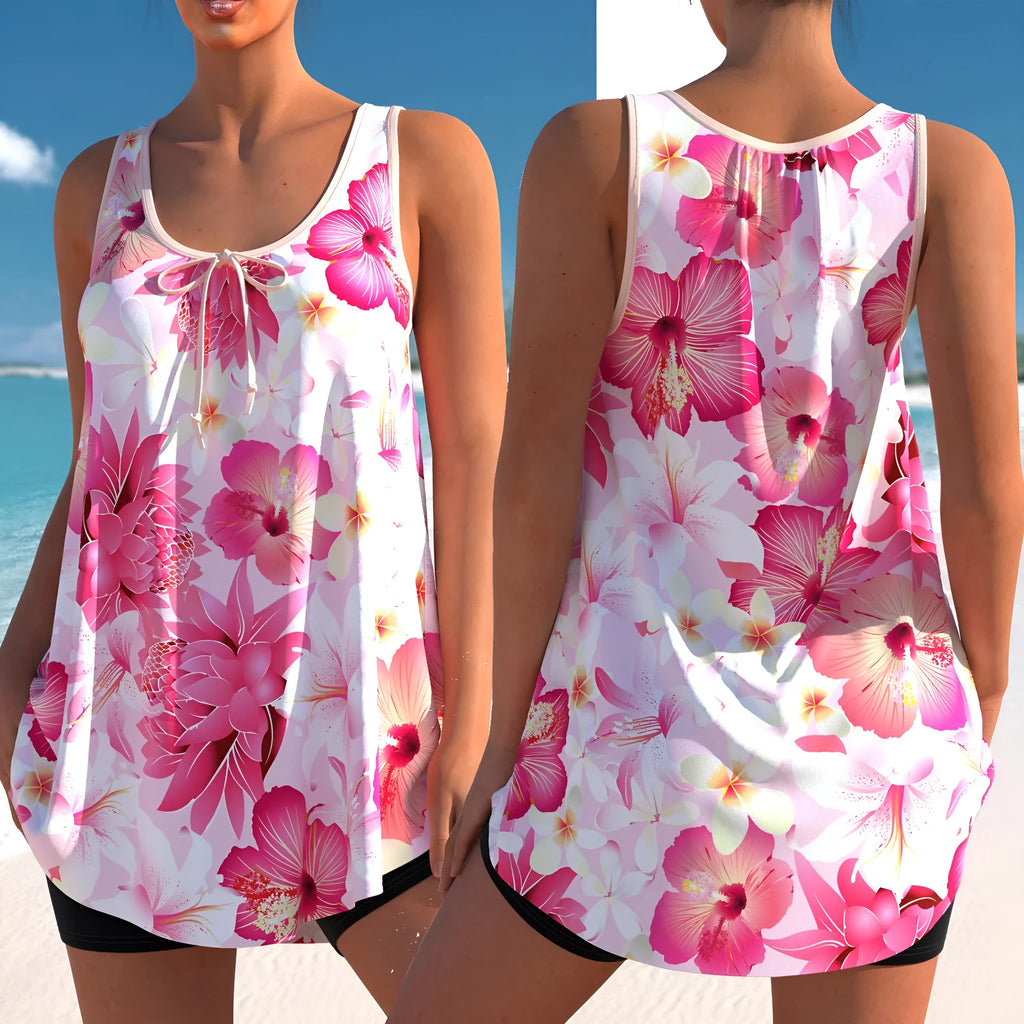 Pink printed plus size tankini swimsuit with high waist briefs on a hanger.