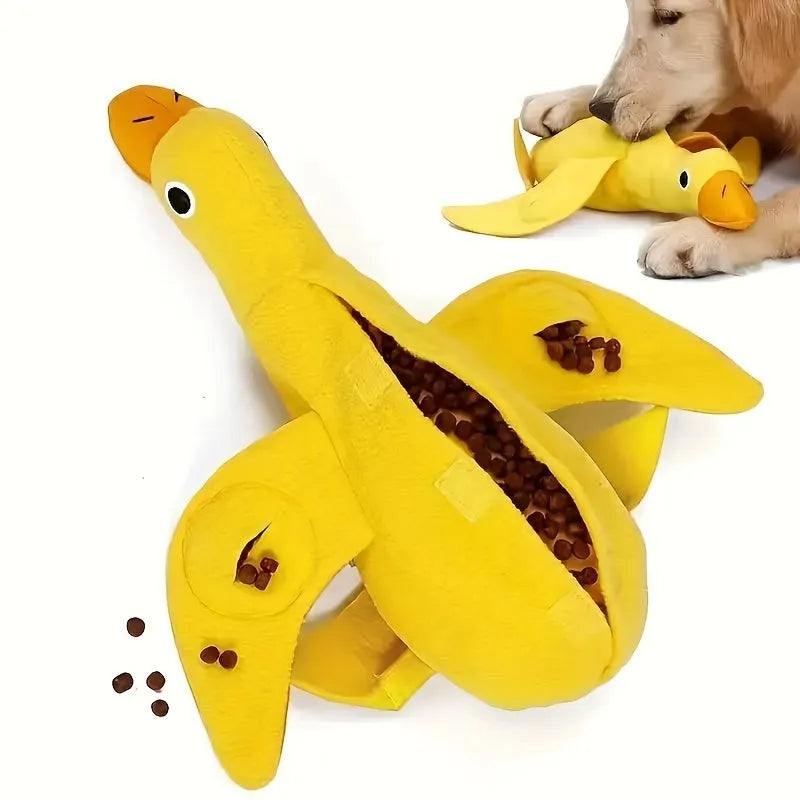 Yellow teddy dog toy with central duck doll, featuring a squeaker and treat leak compartment.