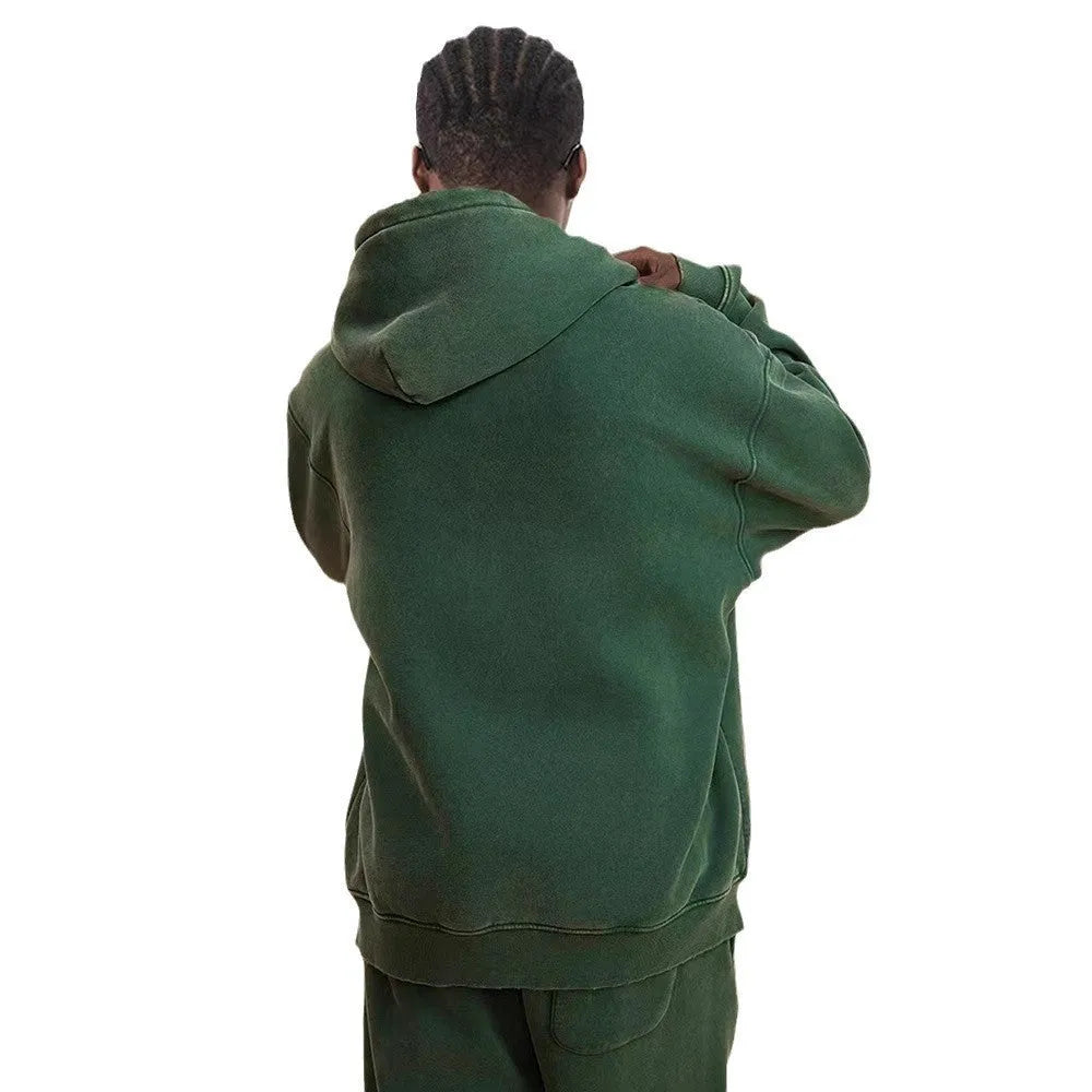 Men's hooded cardigan in cotton with fleece lining and a double zipper, shown in dark green colour