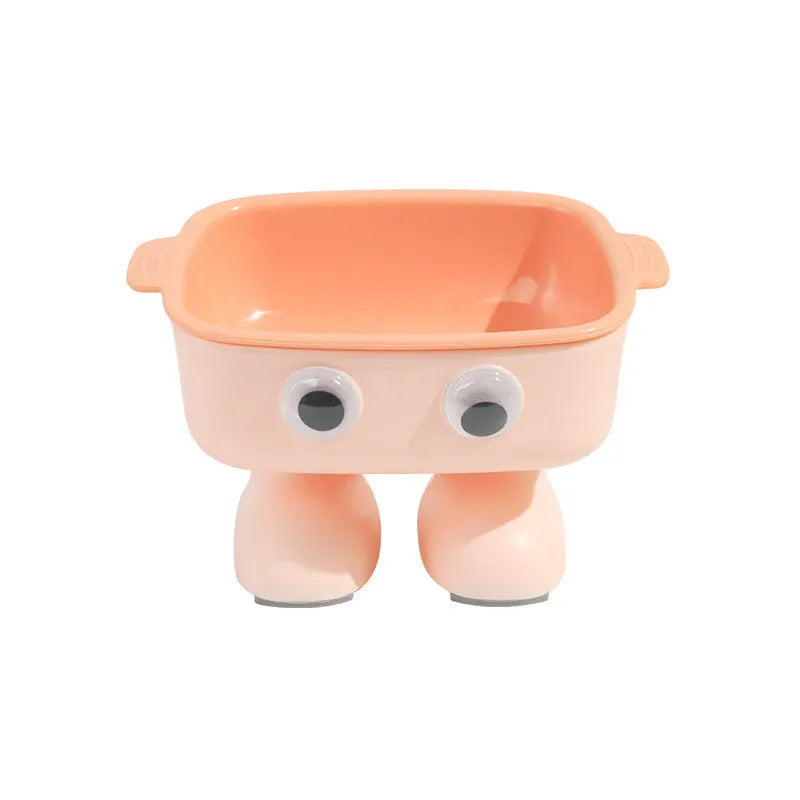 Green elevated cat bowl with 15-degree tilt, detachable inner dish, and cartoon robot design on a table.