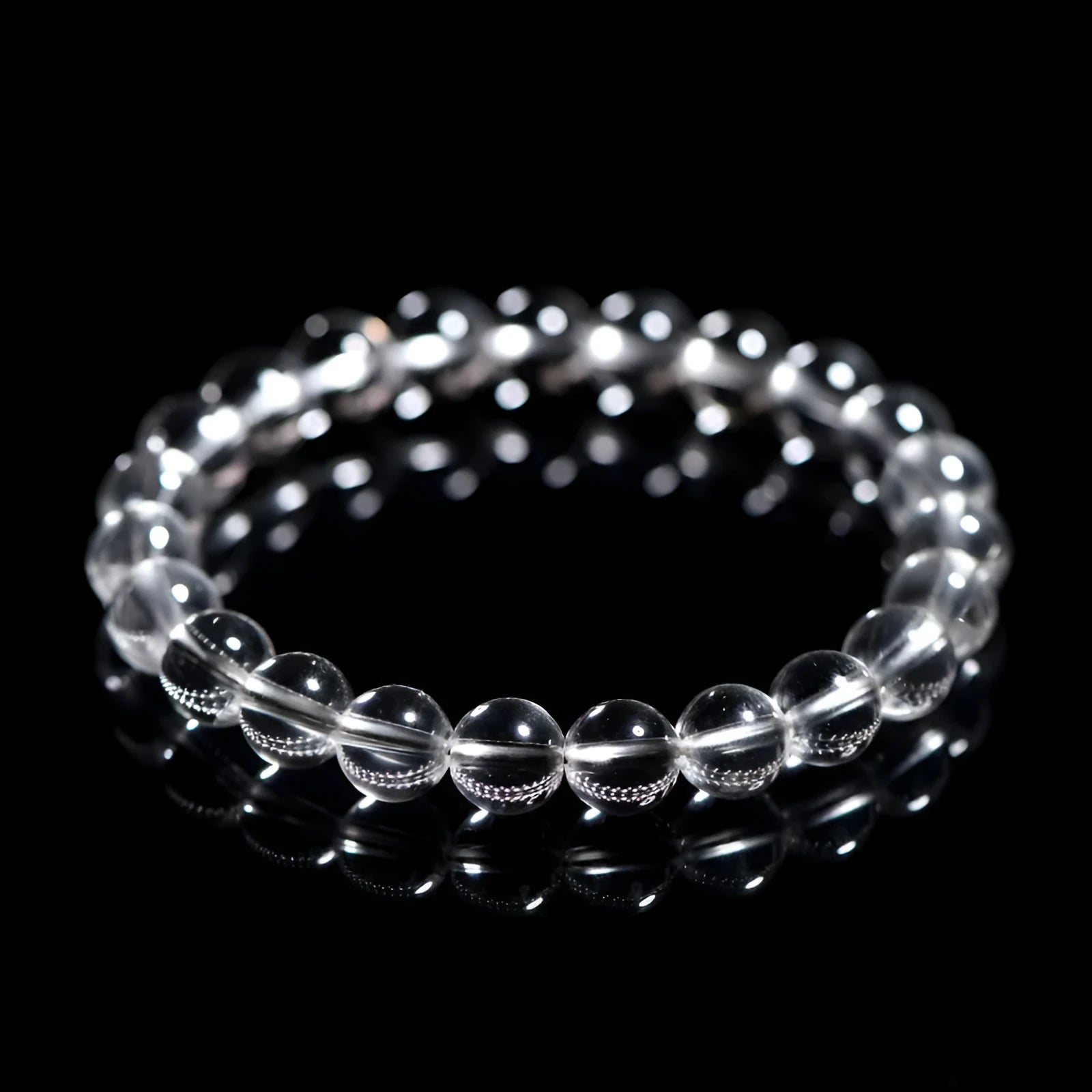 Natural Donghai Old Mine white crystal round bead bracelet on a wrist, showing geometric single strand design.