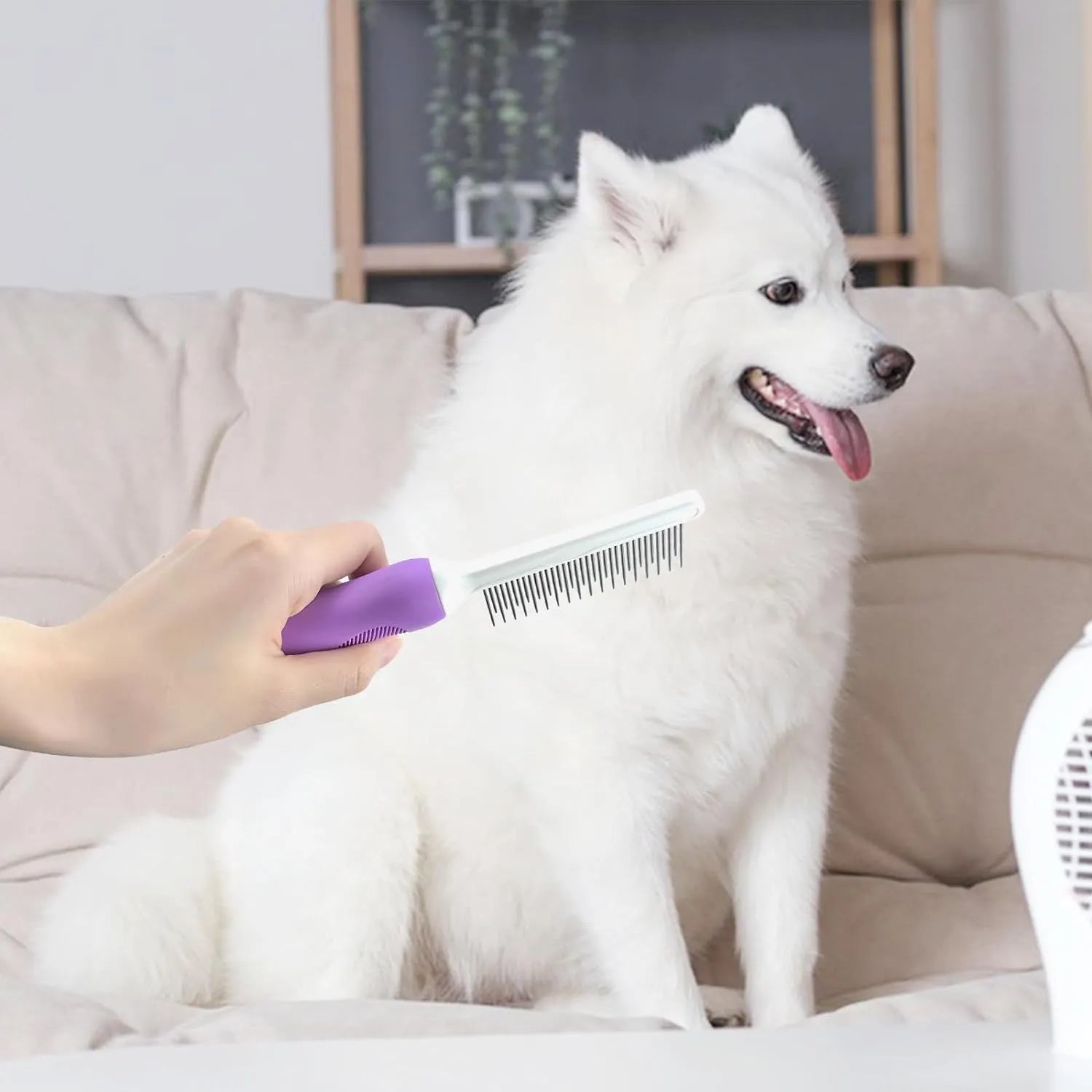 Purple pet detangling comb with stainless steel teeth shown on a dark background