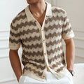 Men's blue short-sleeve sweater with a textured hollow jacquard corrugated pattern.