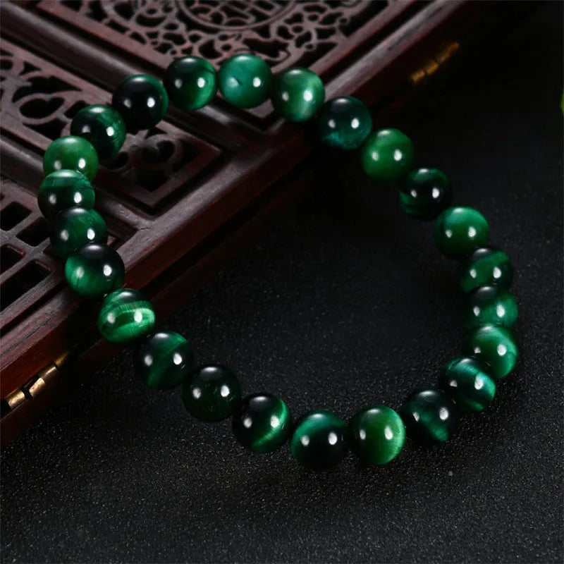 Green tiger eye stone bracelet with geometric beads in polished finish