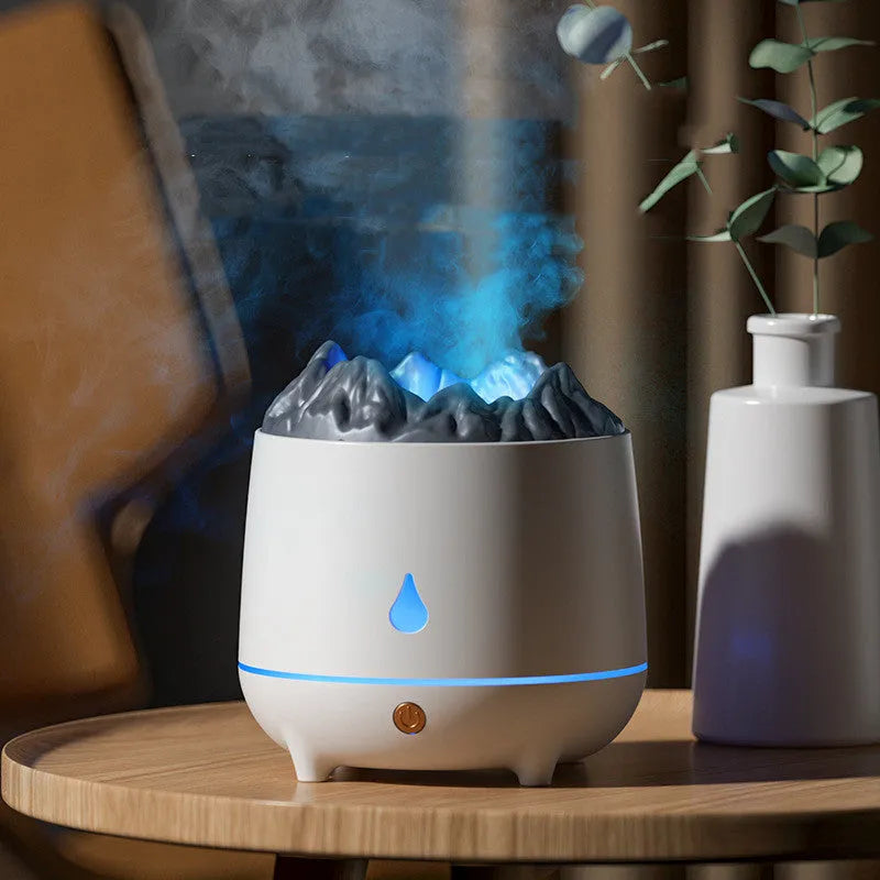 White volcano-shaped ultrasonic humidifier and aromatherapy diffuser with USB cable.
