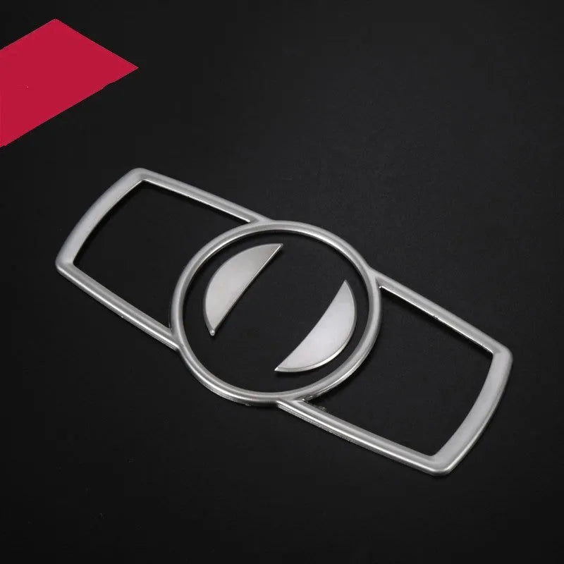 Silver ABS plastic decorative strip sticker for BMW headlight switch frame interior modification.