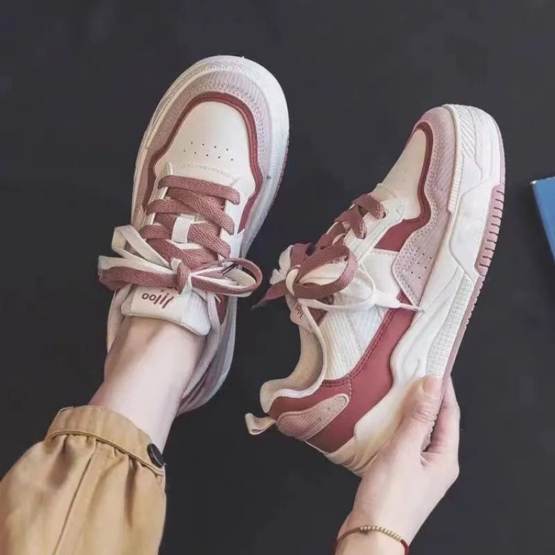 Low-top sneakers with rubber soles in beige and pink colour options showing height-increasing design