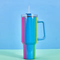 Large stainless steel vacuum insulation cup in a rainbow colour or gradient finish, showing its tall 27.5 cm height and wide 10 cm opening.