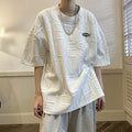 Men's grey loose fit T-shirt with a three-dimensional retro letter pattern on the front.