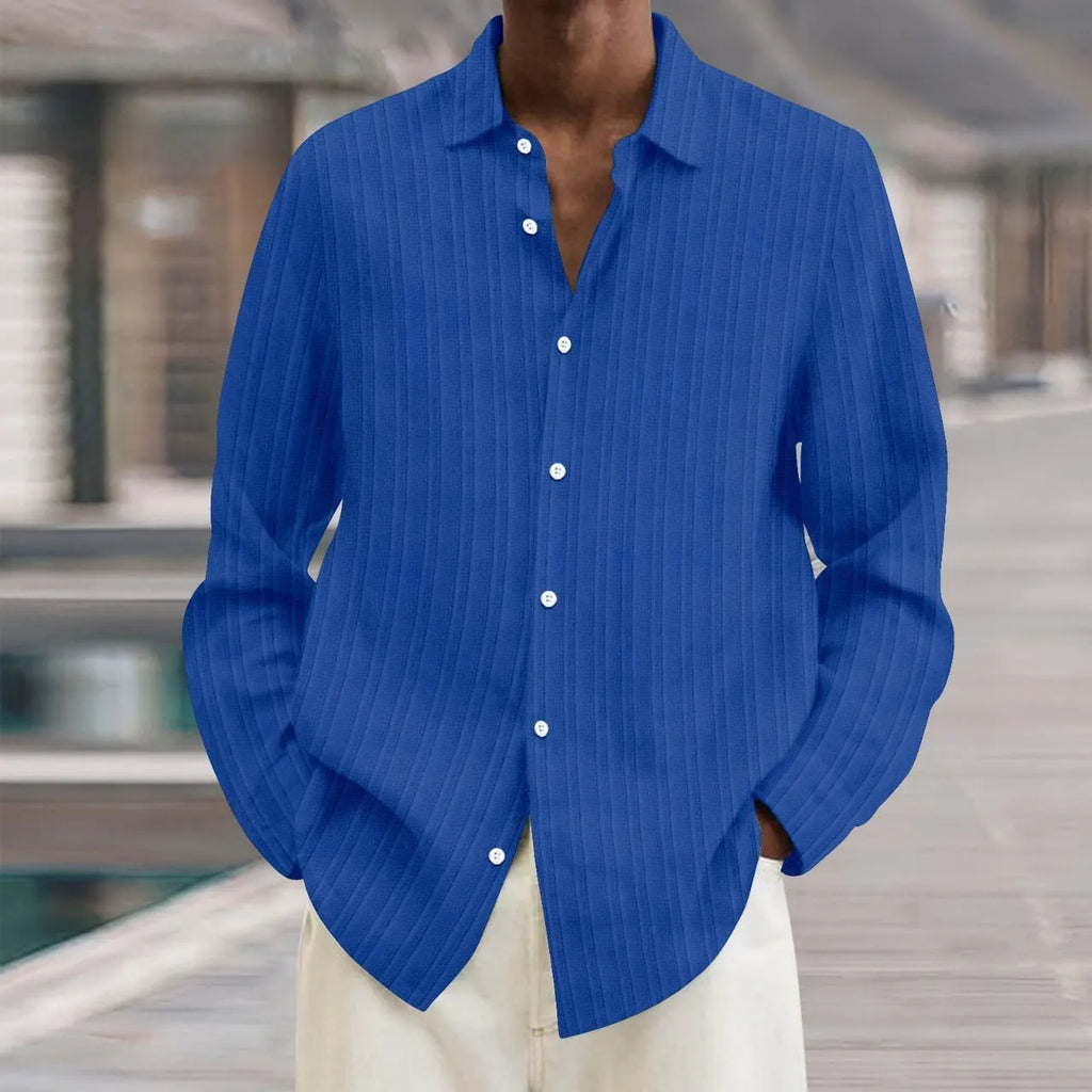 Man wearing a loose-fit, striped, long-sleeve cardigan in a blue colour variant