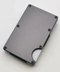 Aluminium alloy grey carbon fibre credit card wallet with RFID blocking feature, showing slim stowable profile.