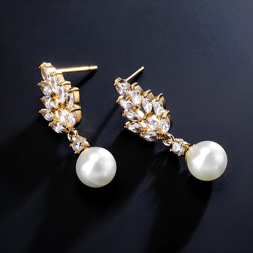 Geometric floral earrings with micro-set zircon stones in gold, platinum, or rose gold plating.
