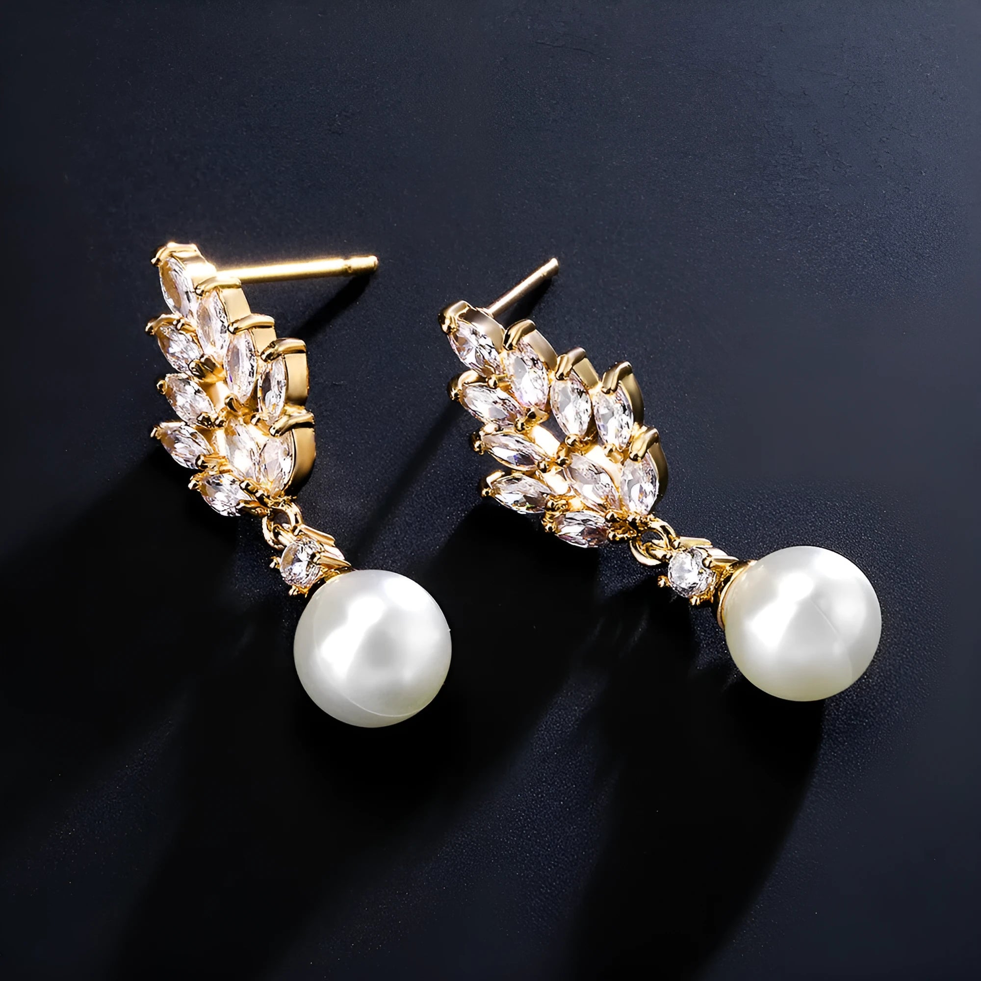 Geometric floral earrings with micro-set zircon stones in gold, platinum, or rose gold plating.