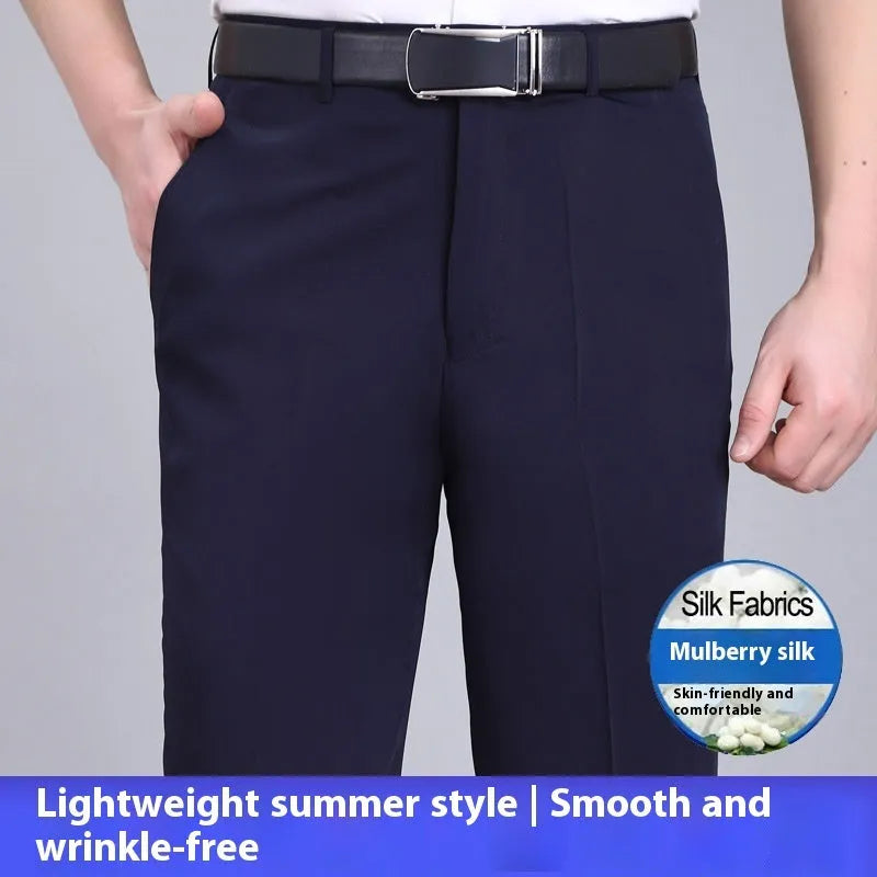 Men's straight-leg suit trousers in a dark blue colour, showing high waist and business cut.