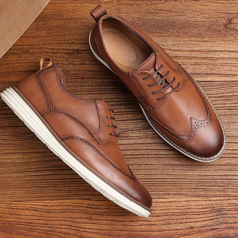 Men's black and brown slip-on business casual shoes with round toe and low top.