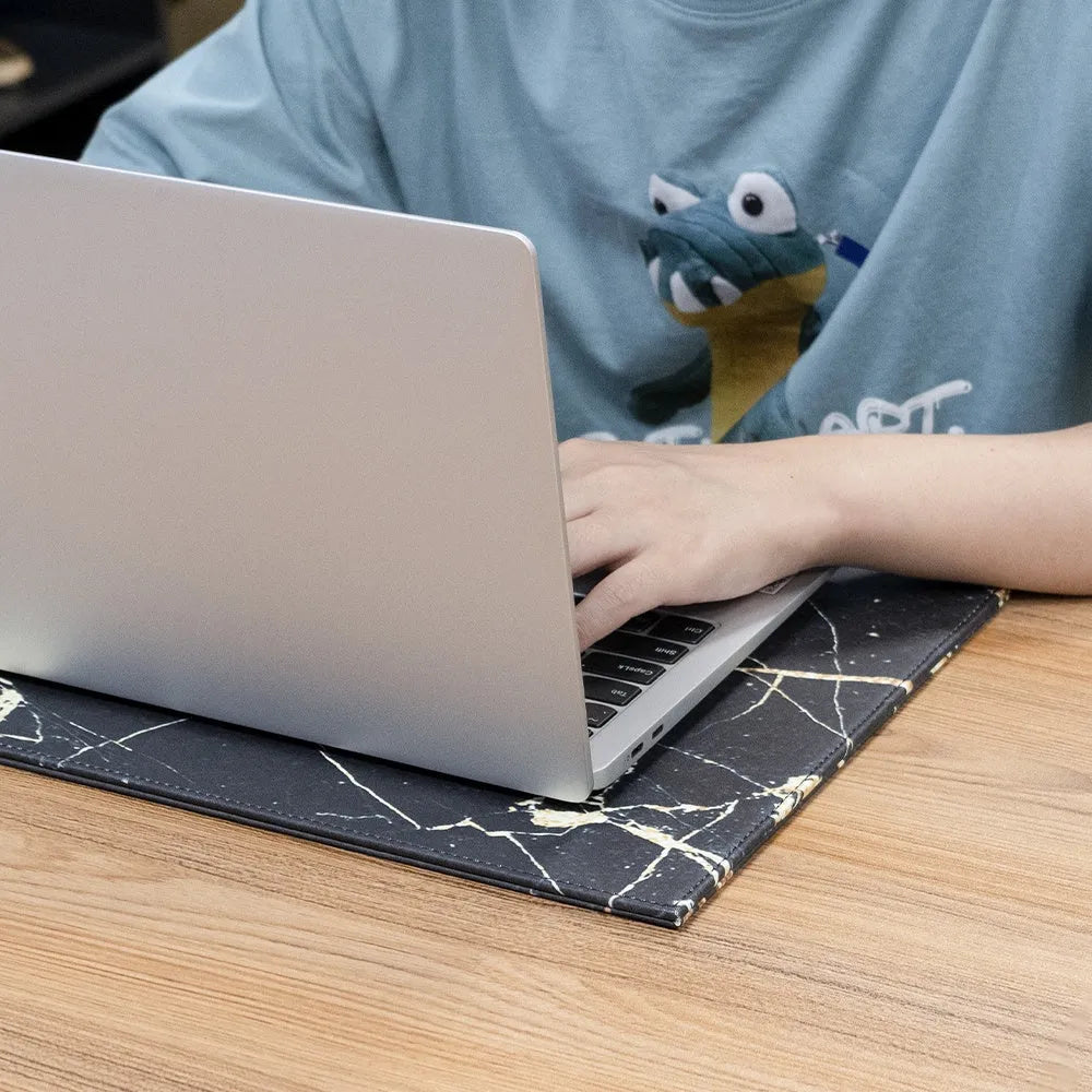 Durable heat-insulating anti-radiation tablet pad in four colour variations on a desk