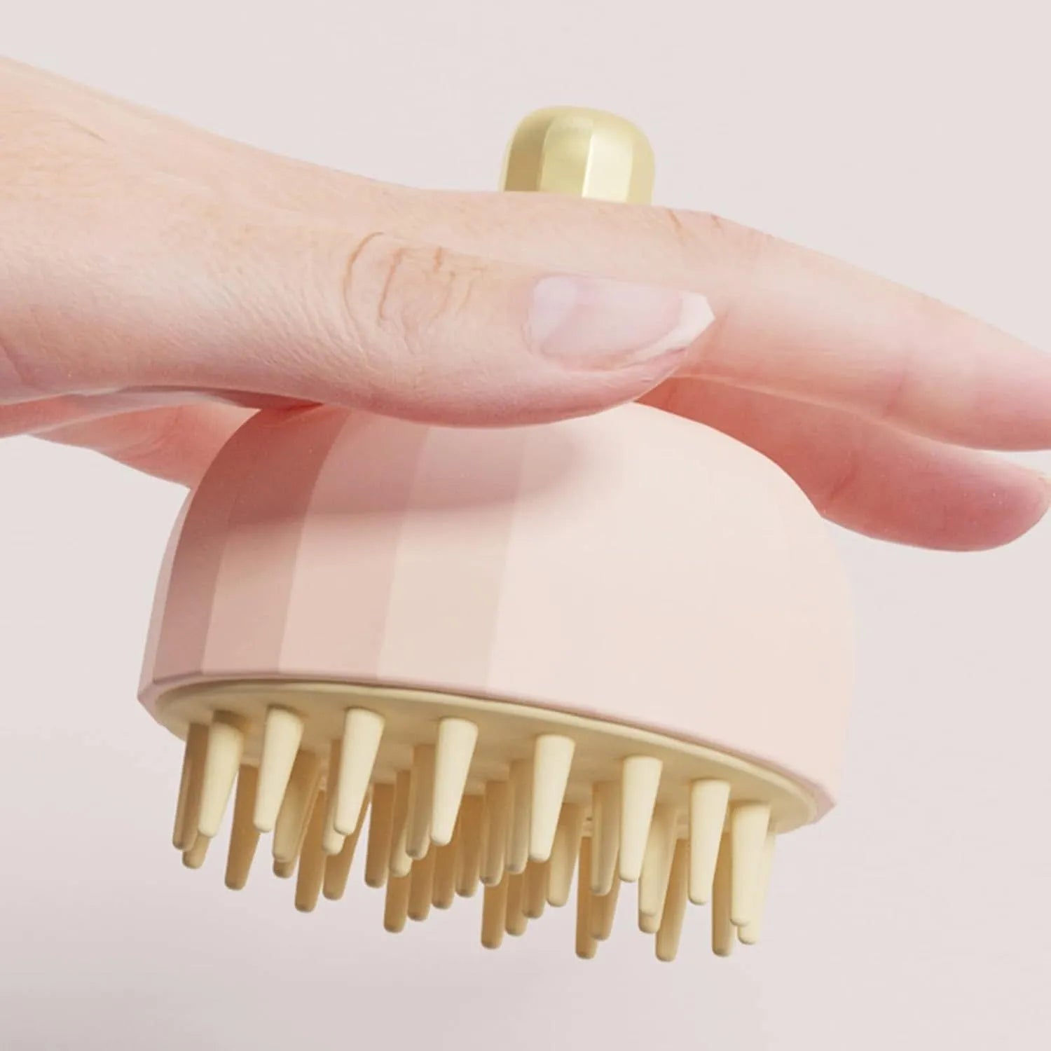 Green double-sided pet bath massage brush with drainage holes on a white background