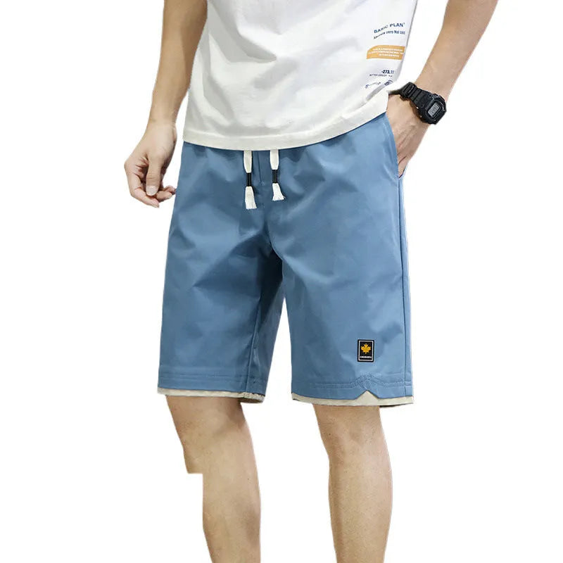 Men's loose-fit casual beach shorts in a South Korea style, shown in a green colour.