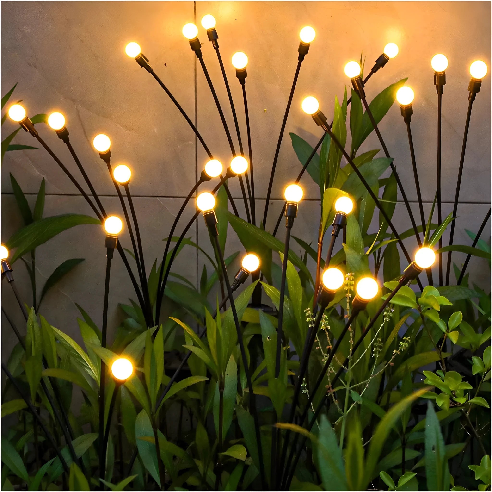 Solar-powered LED ground spike garden light with automatic sensor in lawn