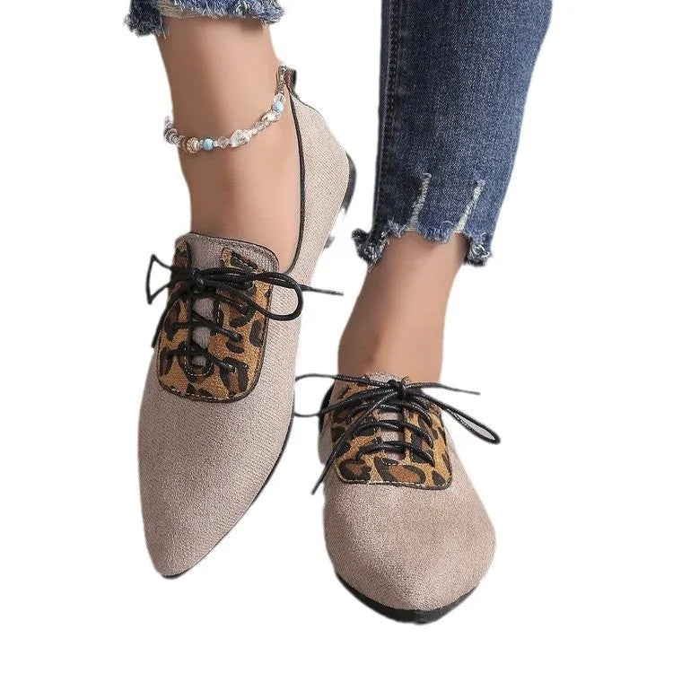 Beige leopard print women's pumps with a pointed toe, shown in a plus size.