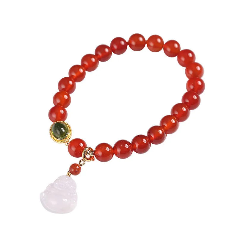 Handmade red agate and amber bracelet with geometric beads and a gold Maitreya Buddha charm.