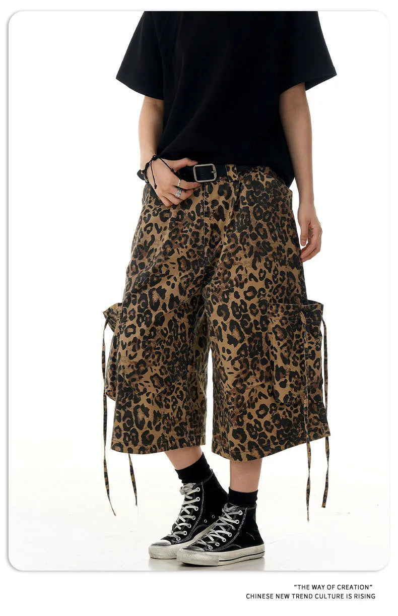 Leopard print high-waisted loose-fit cropped cotton trousers on a hanger