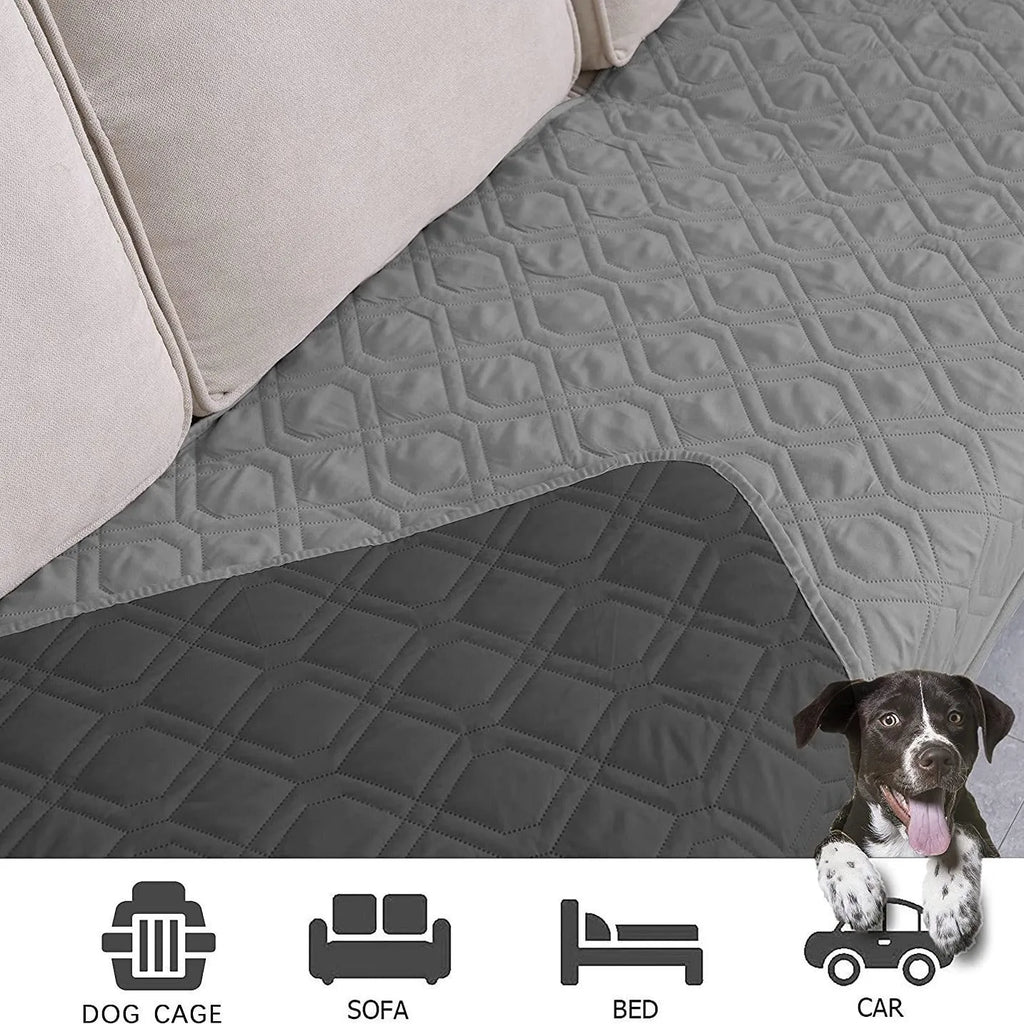 Reversible dog blanket on a sofa showing two colour sides, available in multiple sizes.