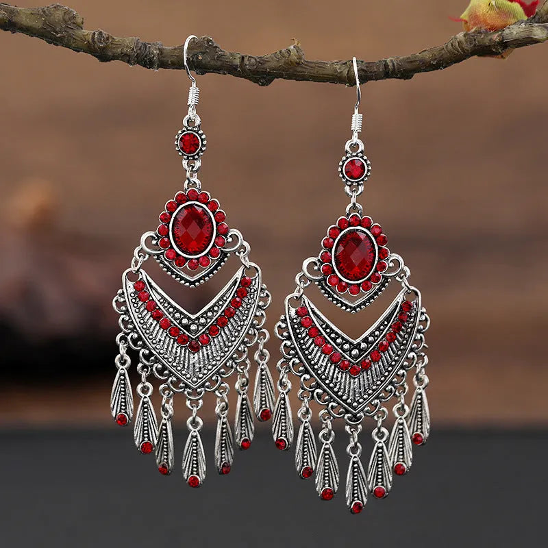Pair of long purple drop shape fringe earrings with crystals in a retro ethnic style.