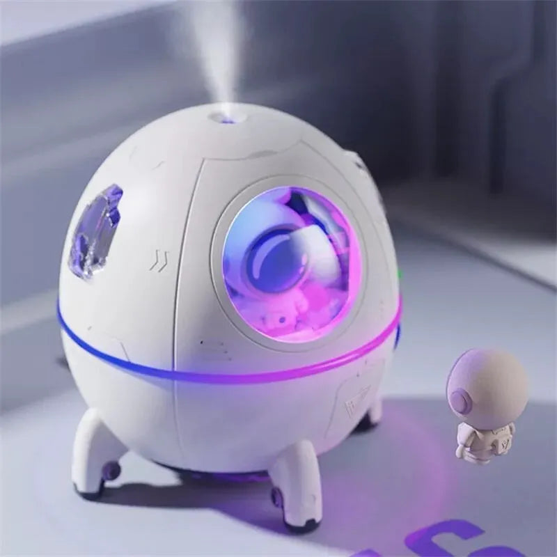 Astronaut-themed USB desktop humidifier with colourful LED base and compact 110mm design