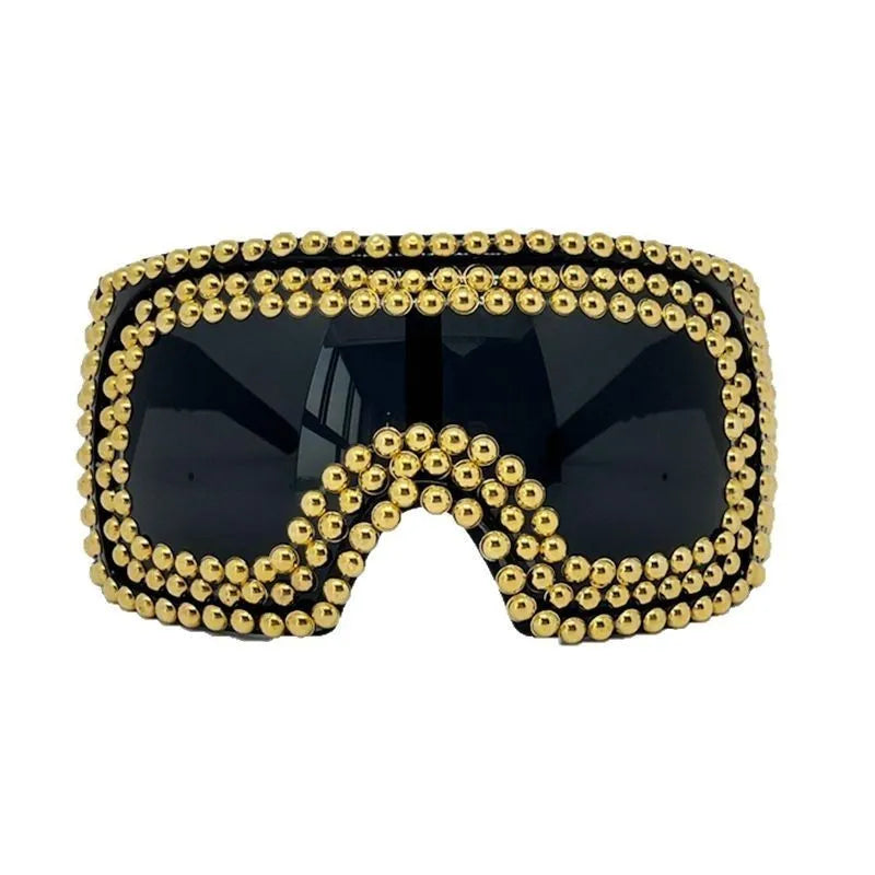 Men's punk style square sunglasses with large rims and rivet detailing in silver colour