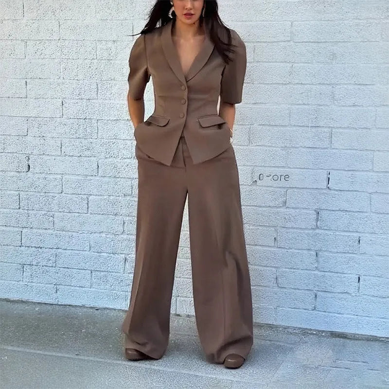 Brown men's slim fit polyester suit with long sleeves and trousers on a hanger