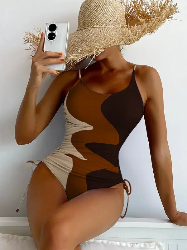Blue sleeveless one-piece swimsuit with a backless, tight-fitting design on a mannequin.