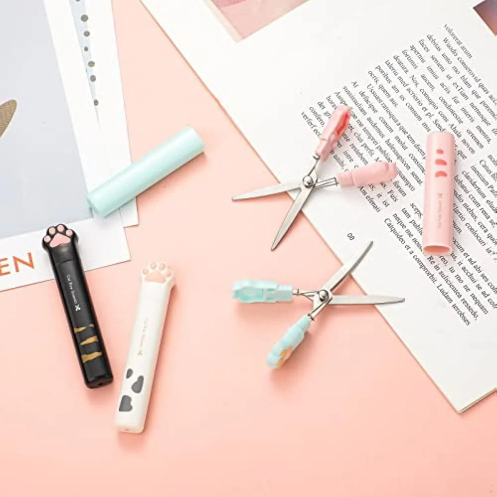 Cat paw mini folding safety scissors showing stainless steel blades and decorative handles in four colour options