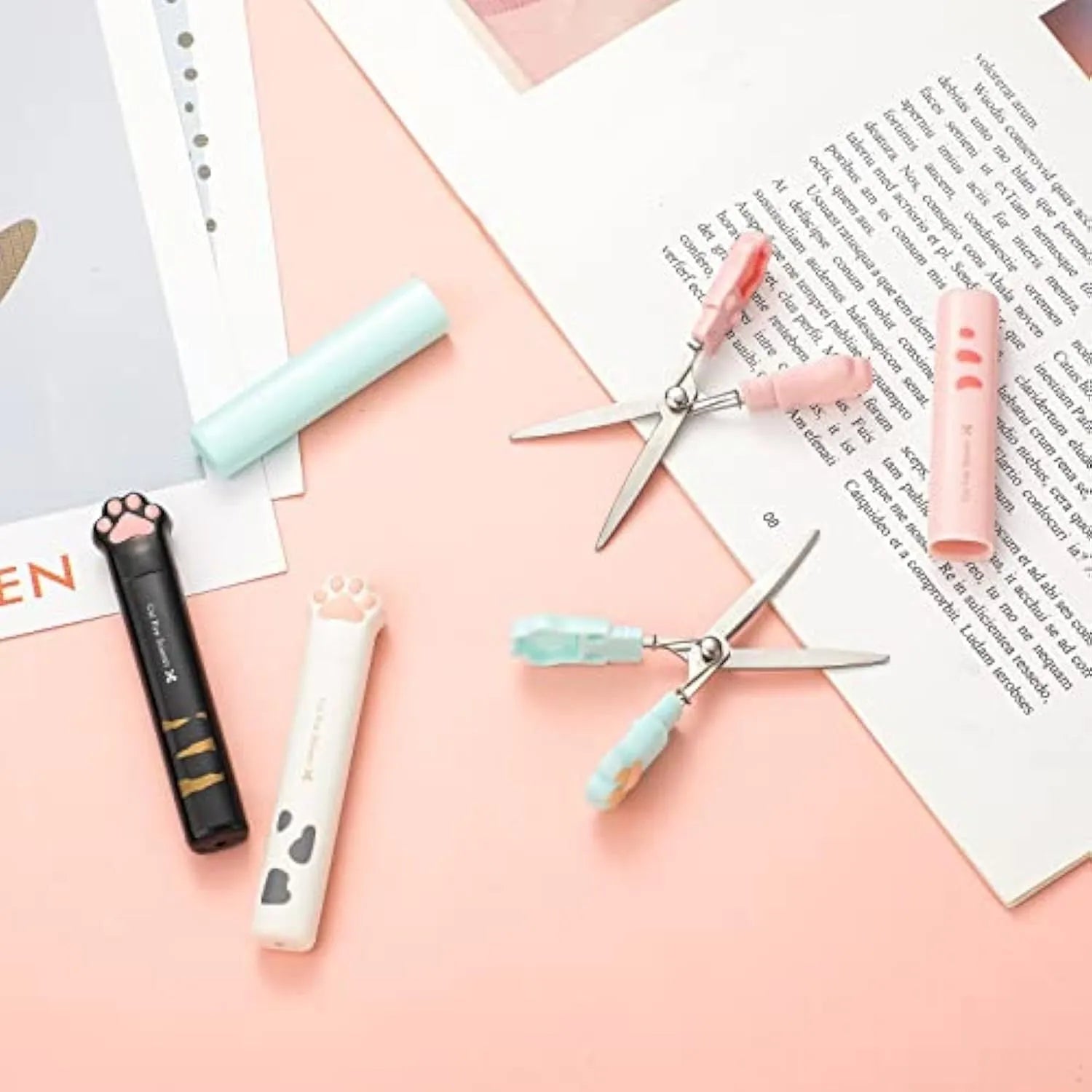 Cat paw mini folding safety scissors showing stainless steel blades and decorative handles in four colour options