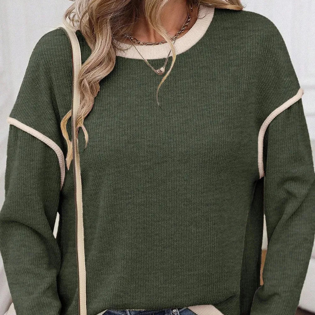 Women's beige knit top with Four Leaf Clover design, drop shoulders, and contrast trim.