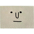 Square PVC floor mat with a geometric cartoon face pattern in Mr. Big Nose colour.