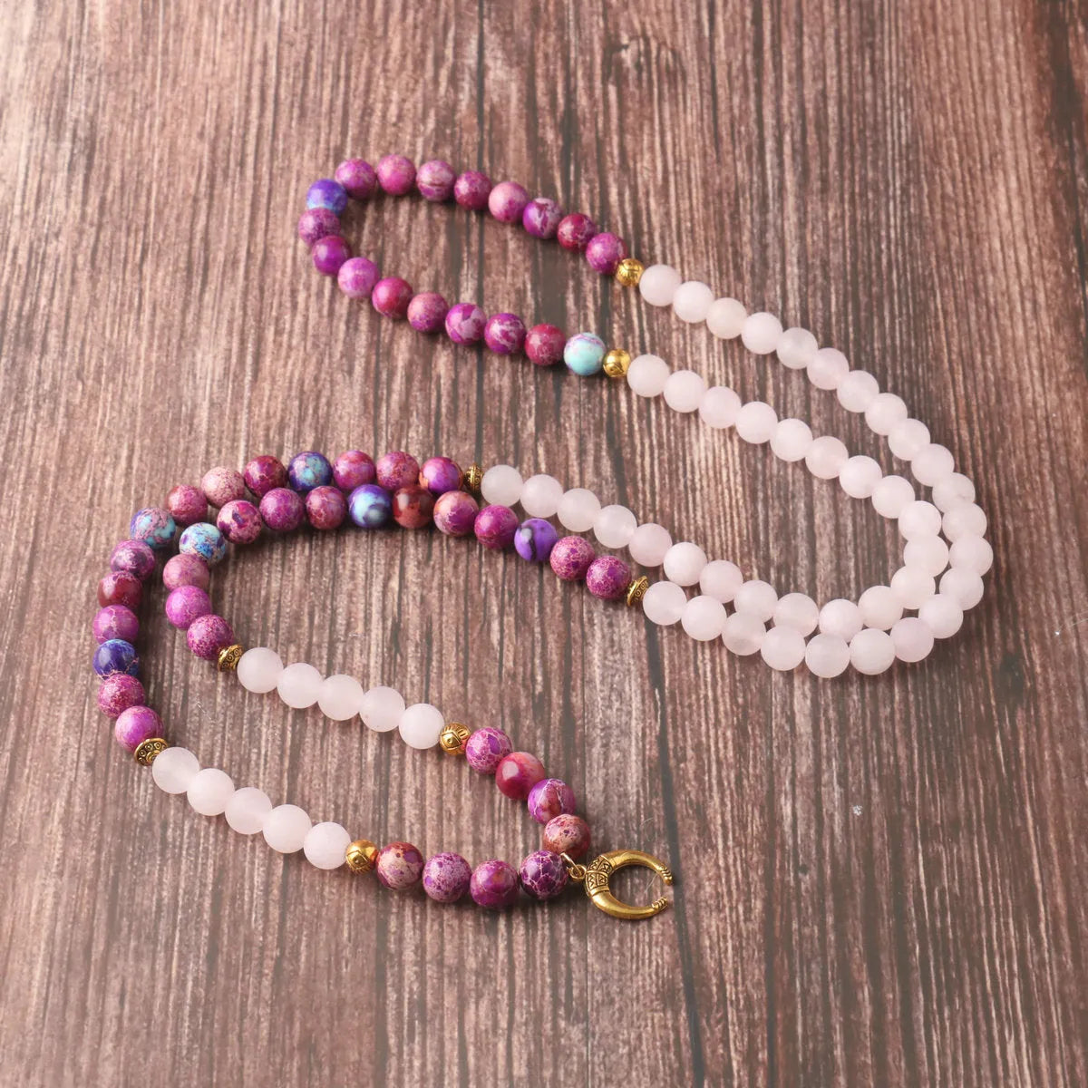 Round Emperor Stone necklace pendant with pink crystal detailing on chain