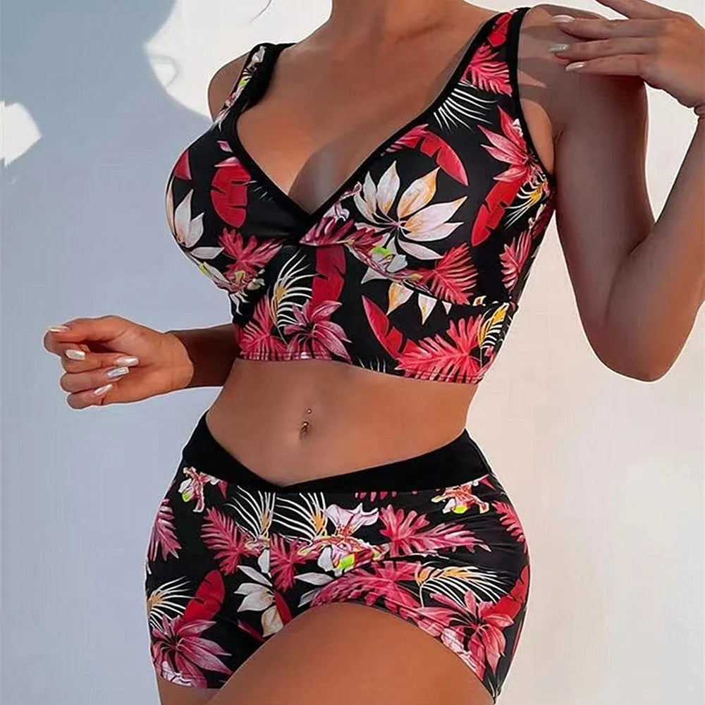 Women's two-piece swimsuit set with printed boxer briefs and sleeveless top on a hanger.