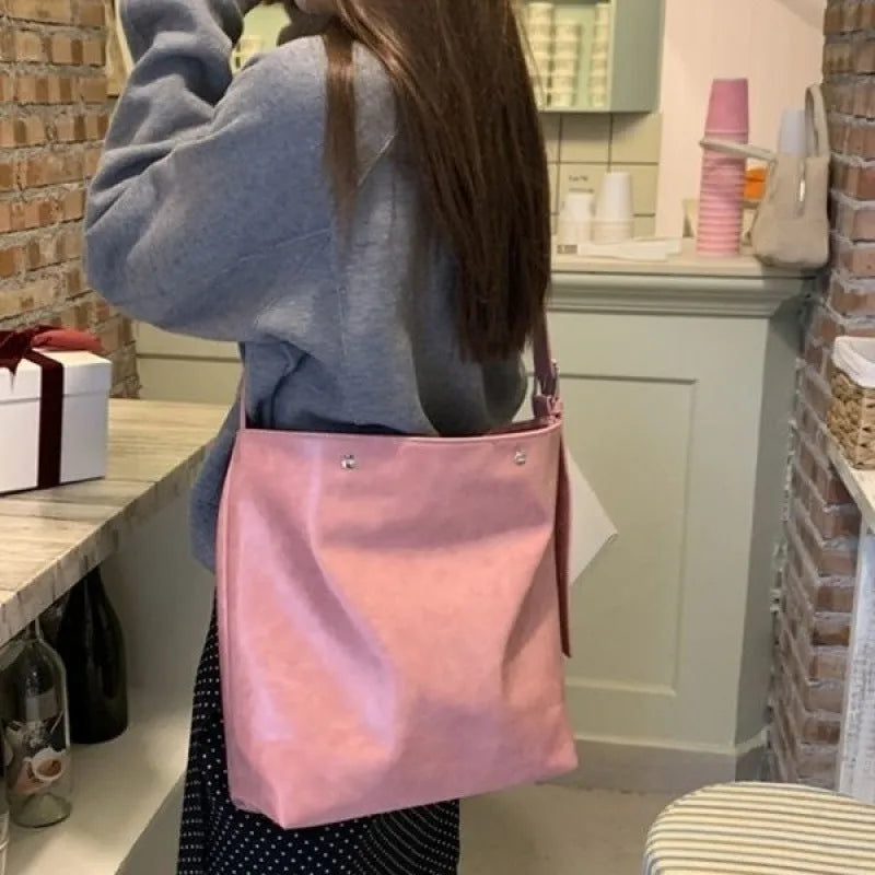 Corduroy commuter shoulder bag in pink or brown with PU lining and single strap